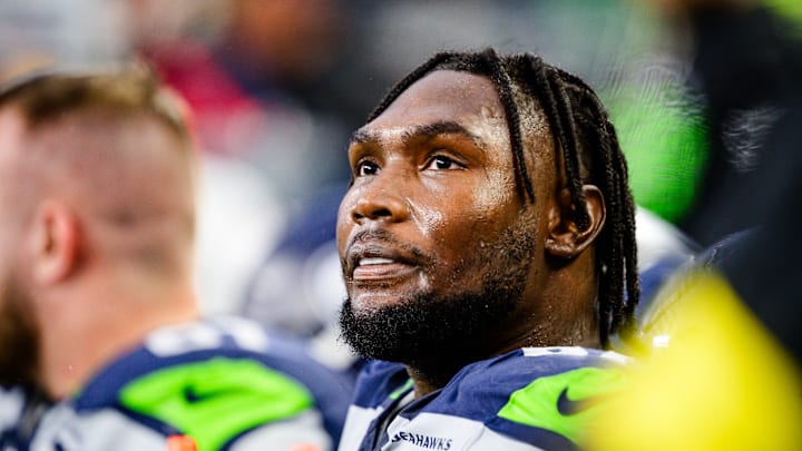 Charles Cross of the Seattle Seahawks on the sidelines
