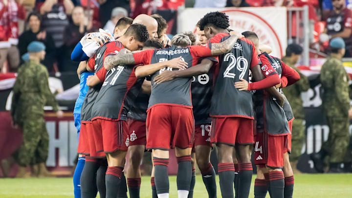 Toronto FC players huddle before the MLS game between...