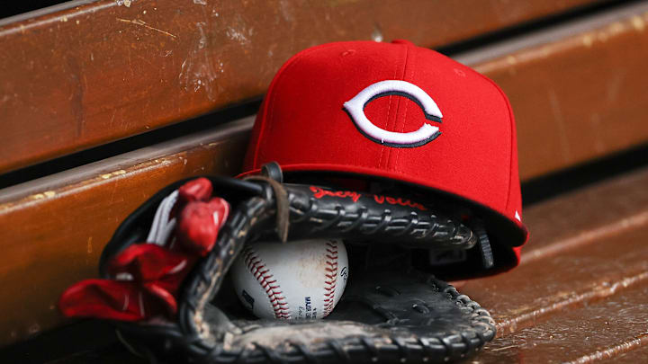 Cincinnati Reds hat sits in the dugout.