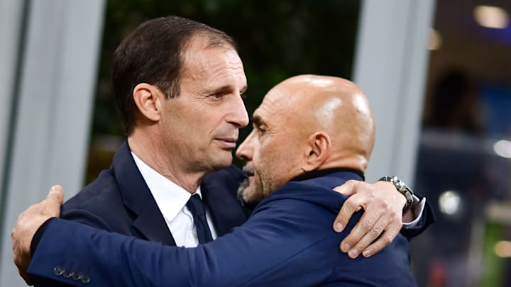 Massimiliano Allegri (L), head coach of Juventus FC, hugs...