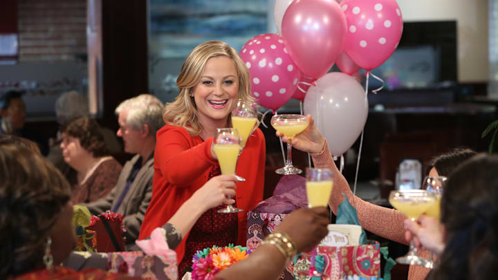 Amy Poehler toasts with mimosas in an episode from 'Parks and Recreation'