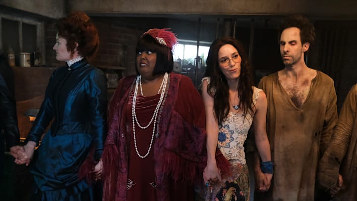 “Patience” – While Sam and the ghosts race to find him, Isaac comes face to face with Puritan ghost Patience (Mary Holland) for the first time since she was lost in the dirt, on the fourth season premiere of the CBS Original series GHOSTS, Thursday, Oct. 17 (8:30-9:00 PM, ET/PT) on the CBS Television Network, and streaming on Paramount+ (live and on demand for Paramount+ with SHOWTIME subscribers, or on demand for Paramount+ Essential subscribers the day after the episode airs)*. Pictured (L-R):