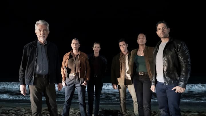 L-R: BTS of Joe Mantegna as David Rossi, Paget Brewster as Emily Prentiss, A.J. Cook as Jennifer ‘JJ’ Jareau, RJ Hatanaka as Tyler Green, Aisha Tyler as Dr. Tara Lewis, and Adam Rodriguez as Luke Alvez on the set of Criminal Minds: Evolution, episode 1, season 18 streaming on Paramount+, 2025. Photo Credit: Michael Yarish/Paramount+