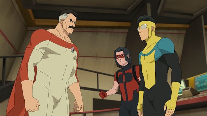 Omni-Man (JK Simmons), Oliver Grayson (Christian Convery), Invincible (Steven Yeun) in Invincible season 4. Courtesy of Prime Video.