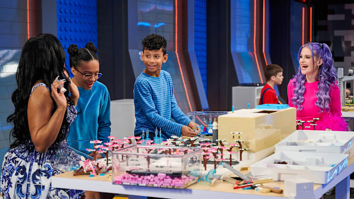 LEGO MASTERS JR: L-R: Special guest Porsha Williams, contestant Zoe, contestant Max and Host Kelly Osbourne in the LEGO MASTERS JR Series Premiere episode "Disney Train Ride" airing Monday, August 18 (8:00-9:02 PM ET/PT) on FOX. CR: Tom Griscom/FOX. ©2025 FOX MEDIA LLC.