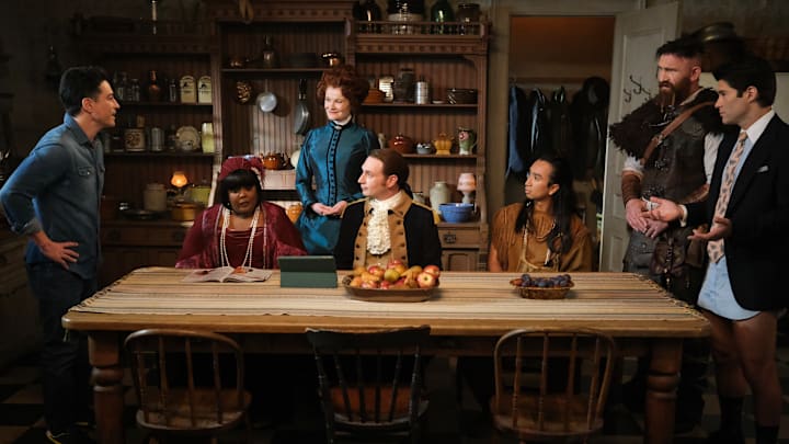 “Planes, Shanes and Automobiles” – Pictured (L-R): Ben Feldman as Kyle, Danielle Pinnock as Alberta, Rebecca Wisocky as Hetty, Brandon Scott Jones as Isaac, Román Zaragoza as Sasappis, Devan Chandler Long as Thorfinn, and Asher Grodman as Trevor. Photo: Bertrand Calmeau/CBS ©2025 CBS Broadcasting, Inc. All Rights Reserved.