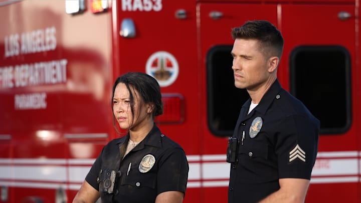 MELISSA O'NEIL and ERIC WINTER standing together from The Rookie