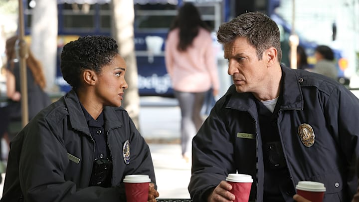 MEKIA COX and NATHAN FILLION looking at each other from The Rookie