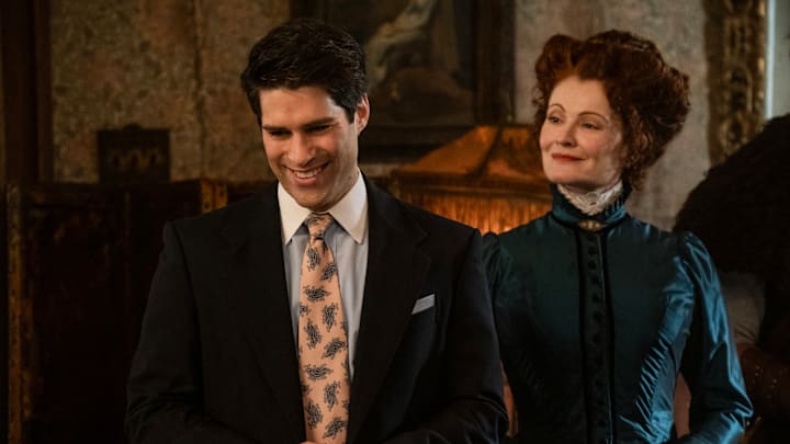 “Bring Your Daughter to Work Day” – GHOSTS. Pictured (L-R): Asher Grodman as Trevor and Rebecca Wisocky as Hetty. Photo: Bertrand Calmeau/CBS ©2025 CBS Broadcasting, Inc. All Rights Reserved. “Bring Your Daughter to Work Day” – GHOSTS. Pictured (L-R): Asher Grodman as Trevor and Rebecca Wisocky as Hetty. Photo: Bertrand Calmeau/CBS ©2025 CBS Broadcasting, Inc. All Rights Reserved.