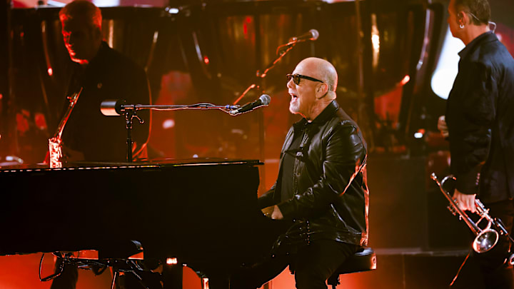 Billy Joel performing at The 66th Annual Grammy Awards.
