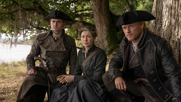 Charles Vandervaart (“William Ransom”), Caitríona Balfe (“Claire Fraser”), and Sam Heughan (“Jamie Fraser”) in Outlander season 8 Episode 9. 