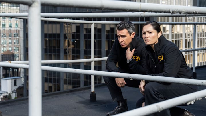 “Ratlined” – Pictured (L-R): John Boyd as Special Agent Stuart Scola and Juliana Aidén Martinez as Eva Ramos. Photo: Bennett Raglin/CBS ©2025 CBS Broadcasting, Inc. All Rights Reserved. “Ratlined” – Pictured (L-R): John Boyd as Special Agent Stuart Scola and Juliana Aidén Martinez as Eva Ramos. Photo: Bennett Raglin/CBS ©2025 CBS Broadcasting, Inc. All Rights Reserved.
