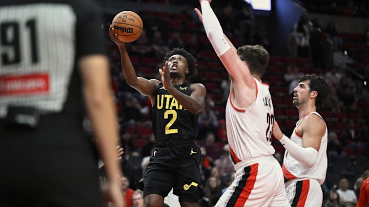 Oct 18, 2024; Portland, Oregon, USA; Utah Jazz guard Collin Sexton (2) drives to the basket during the first half against Portland Trail Blazers center Donovan Clingan (23) at Moda Center. Mandatory Credit: Troy Wayrynen-Imagn Images