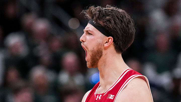 Wisconsin Badgers forward Carter Gilmore (7) yells in celebration Saturday, March 15, 2025, in a semifinals game at the 2025 TIAA Big Ten Men’s Basketball Tournament between the Michigan State Spartans and the Wisconsin Badgers at Gainbridge Fieldhouse in Indianapolis. The Wisconsin Badgers defeated the Michigan State Spartans, 77-74.