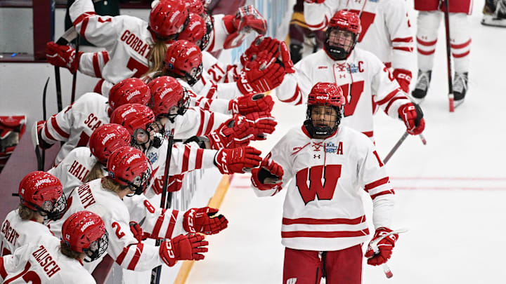 Wisconsin Badgers forward Laila Edwards is congratulated by teammates after scoring a goal against Minnesota in the first period of an NCAA women's Frozen Four semifinal Friday, March 21, 2025, at Ridder Arena in Minneapolis, Minnesota.