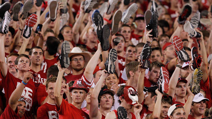 Aug 31, 2013; Lincoln, NE, USA; Nebraska Cornhuskers fans hold a shoe prior to the kickoff against