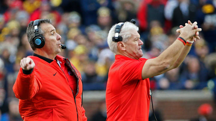 Ohio State Buckeyes head coach Urban Meyer and assistant coach Kerry Coombs call plays against Michigan Wolverines during the 1st half of their game at Michigan Stadium on November 25, 2017. Ohio State Buckeyes head coach Urban Meyer and assistant coach Kerry Coombs call plays against Michigan Wolverines during the 1st half of their game at Michigan Stadium on November 25, 2017.