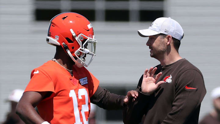 Browns quarterback Shedeur Sanders works with offensive coordinator Tommy Rees during rookie minicamp May 9, 2025, in Berea.