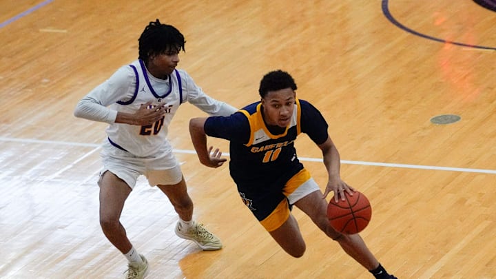 Jan 20, 2024; Reynoldsburg, Ohio, USA; Reynoldsburg Tejuan Barbour (20) guards Garfield Heights