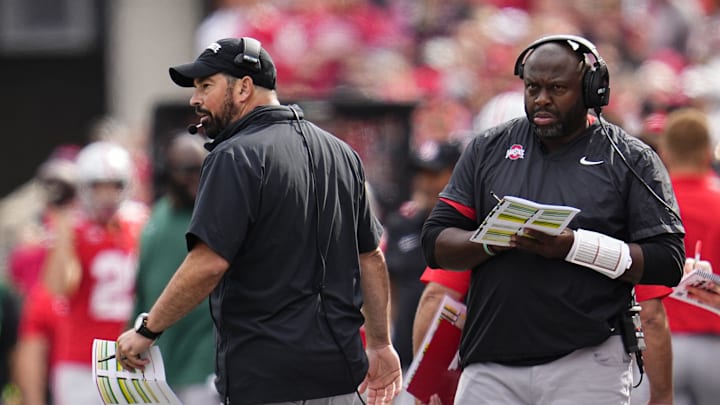 Sep 16, 2023; Columbus, Ohio, USA; Ohio State Buckeyes head coach Ryan Day and running backs coach Tony Alford watch from the sideline during the NCAA football game against the Western Kentucky Hilltoppers at Ohio Stadium. Ohio State won 63-10.