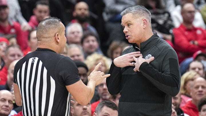 Dec 21, 2022; Columbus, Ohio, United States; Ohio State Buckeyes head coach Chris Holtmann speaks with a referee during the second half of the NCAA division I basketball game at Value City Arena on Wednesday night. Mandatory Credit: Joseph Scheller-The Columbus Dispatch