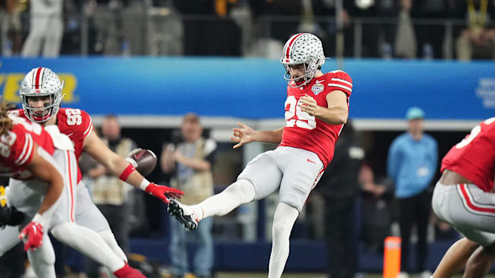 Dec 29, 2023; Arlington, Texas, USA; Ohio State Buckeyes punter Jesse Mirco (29) punts during the third quarter of the Goodyear Cotton Bowl Classic against the Missouri Tigers at AT&T Stadium. Ohio State lost 14-3.