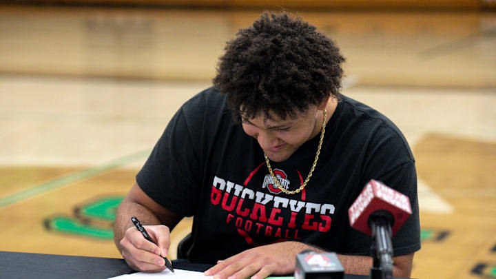 Dec 21, 2022; Dublin, Ohio, United States; Will Smith Jr. signs a letter of intent to play football with Ohio State University during a signing ceremony at Rock Arena at Dublin Coffman High School. Mandatory Credit: Joseph Scheller-The Columbus Dispatch

Football Will Smith Signing Day Ceremony