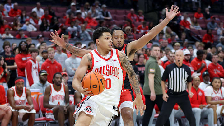 Nov 11, 2024; Columbus, Ohio, USA;  Ohio State Buckeyes guard John Mobley Jr. (0) drives past Youngstown State Penguins guard Jason Nelson (0) during the second half at Value City Arena. Mandatory Credit: Joseph Maiorana-Imagn Images
