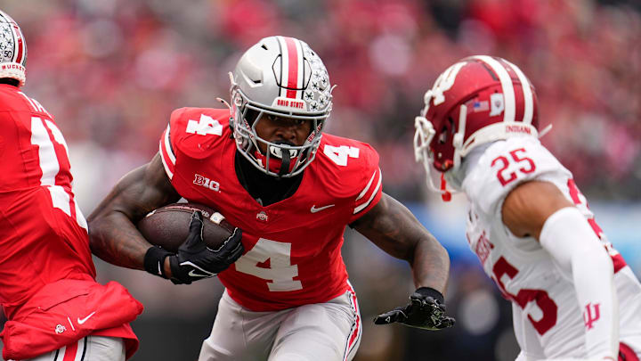 Ohio State Buckeyes wide receiver Jeremiah Smith (4) runs toward Indiana Hoosiers defensive back Amare Ferrell (25) during the second half of the NCAA football game at Ohio Stadium in Columbus on Saturday, Nov. 23, 2024. Ohio State won 38-15.