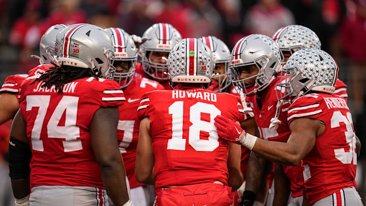 Ohio State Buckeyes quarterback Will Howard (18) talks to his team in the huddle during the NCAA football game against the Indiana Hoosiers at Ohio Stadium in Columbus on Monday, Nov. 25, 2024. Ohio State won 38-15.