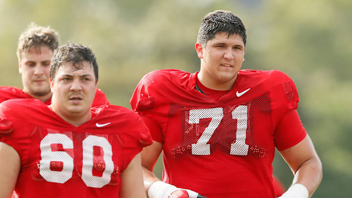 Ohio State Buckeyes offensive lineman Ben Christman (71) runs beside Ryan Smith (60) during football training camp at the Woody Hayes Athletic Center in Columbus on Tuesday, Aug. 10, 2021.

Ohio State Football Training Camp