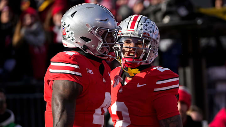 Ohio State Buckeyes wide receiver Emeka Egbuka (2) celebrates a touchdown by wide receiver Jeremiah Smith (4) during the NCAA football game against the Michigan Wolverines at Ohio Stadium in Columbus on Tuesday, Dec. 3, 2024. Michigan won 13-10.