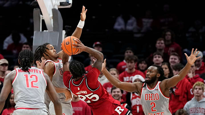 Ohio State Buckeyes guard Meechie Johnson Jr. (1) and guard Bruce Thornton (2) guard Rutgers Scarlet Knights guard Jeremiah Williams (25) during the second half of the NCAA men's basketball game at Value City Arena in Columbus on Saturday, Dec. 7, 2024. Ohio State won 80-66.