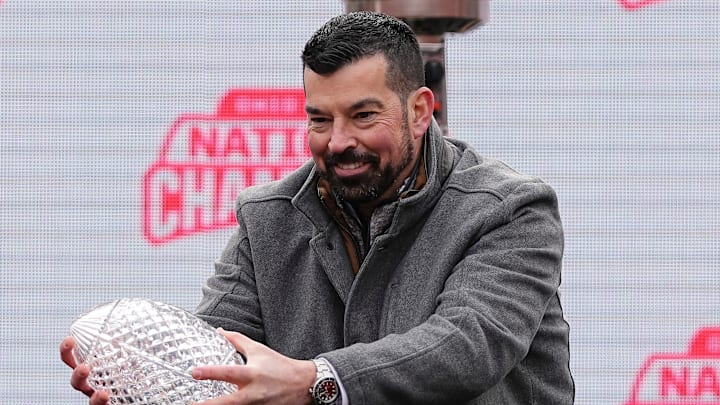 Ohio State Buckeyes head coach Ryan Day holds the Coaches' Trophy during the Ohio State Buckeyes College Football Playoff National Championship celebration at Ohio Stadium in Columbus on Jan. 26, 2025.