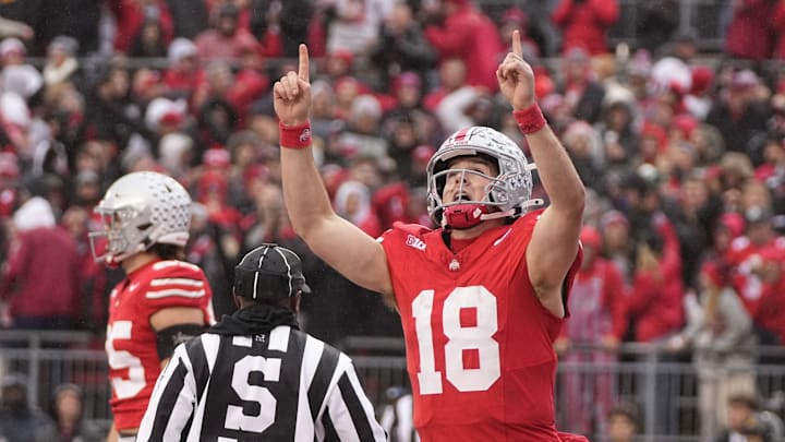 Ohio State Buckeyes quarterback Will Howard (18) celebrates a touchdown during the first half of the NCAA football game against the Indiana Hoosiers at Ohio Stadium in Columbus on Saturday, Nov. 23, 2024.