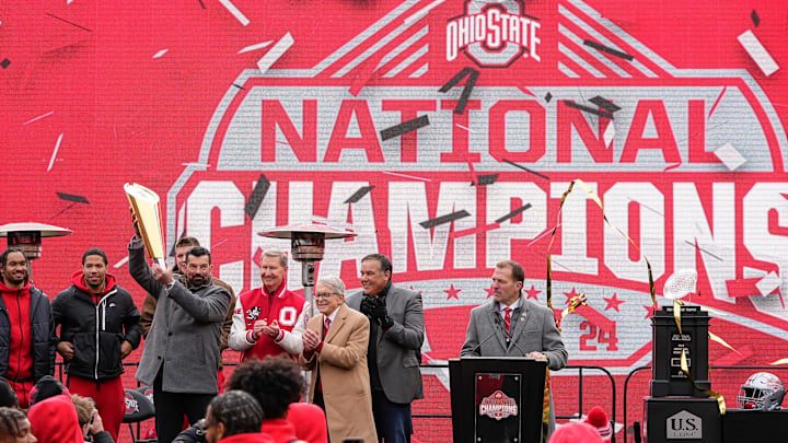 Ohio State Buckeyes head coach Ryan Day hoists the College Football Playoff trophy during the Ohio State Buckeyes National Championship celebration at Ohio Stadium in Columbus on Jan. 26, 2025.