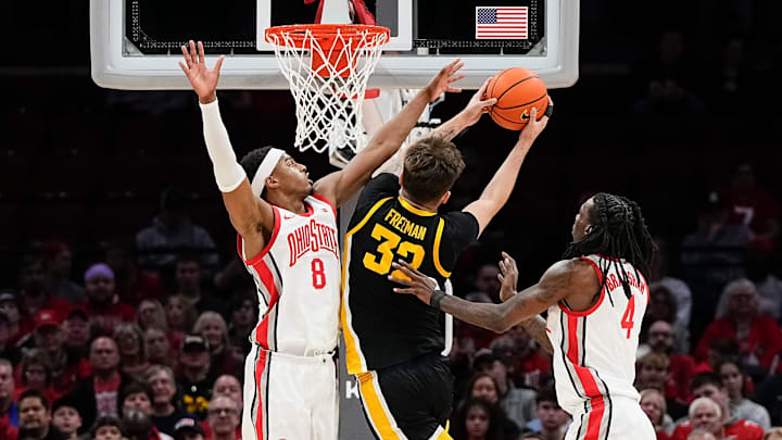Ohio State Buckeyes guard Micah Parrish (8) defends Iowa Hawkeyes forward Owen Freeman (32) during the first half of the NCAA men's basketball game at Value City Arena on Jan. 27, 2025.
