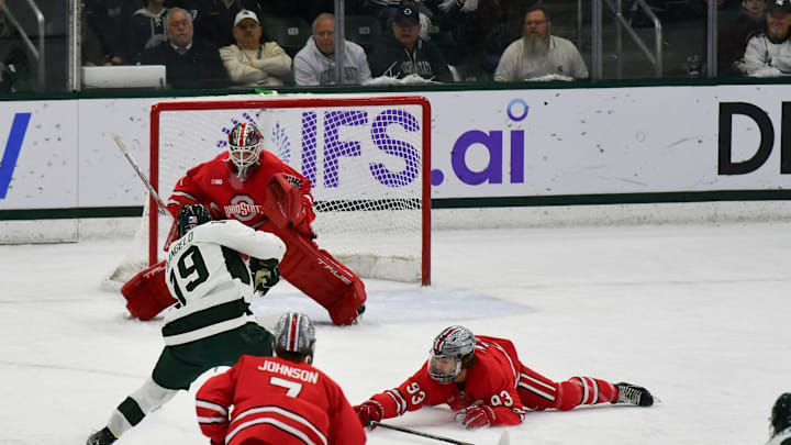MSU's Mikey DeAngelo shoots against Ohio State goalkeeper Logan Terness, Saturday, March 22, 2025, during the first period of the Big 10 Hockey final at Munn Ice Arena. MSU won 4-3 in double overtime.