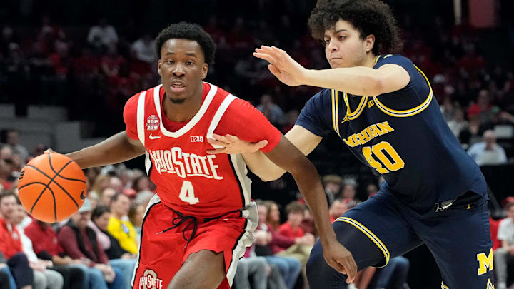 Mar 3, 2024; Columbus, OH, USA; Ohio State Buckeyes guard Dale Bonner (4) dribbles around Michigan Wolverines guard George Washington III (40) during their NCAA Division I Mens basketball game at Value City Arena.