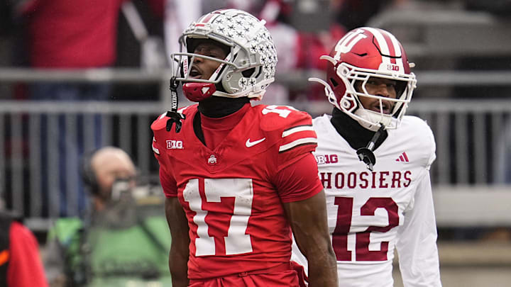 Ohio State Buckeyes wide receiver Carnell Tate (17) celebrates a first down catch beside Indiana Hoosiers defensive back Terry Jones Jr. (12) during the NCAA football game at Ohio Stadium in Columbus on Monday, Nov. 25, 2024. Ohio State won 38-15.