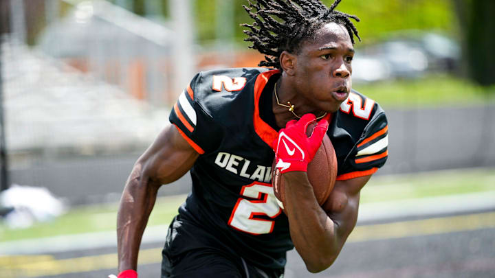 Delaware Hayes’s Favour Akih (2) runs the ball during the college football showcase at the Delaware Hayes High School on Wednesday, May 7, 2025 in Delaware, Ohio.