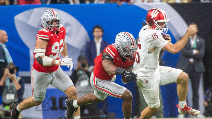 Indiana's Fernando Mendoza (15) runs during the Indiana versus Ohio State Big Ten Championship football game at Lucas Oil Stadium on Saturday, Dec. 6, 2025.