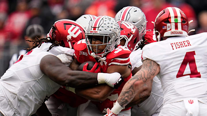 Ohio State Buckeyes running back TreVeyon Henderson (32) runs during the second half of the NCAA football game against the Indiana Hoosiers at Ohio Stadium in Columbus on Saturday, Nov. 23, 2024. Ohio State won 38-15.