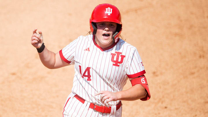 Indiana's Sarah Stone (14) celebrates hitting a homer as she rounds second base during a NCAA Regional softball game between Indiana and Louisville at Sherri Parker Lee Stadium in Knoxville, Tenn., on Friday, May 19, 2023.