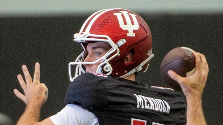 Indiana's Fernando Mendoza (15) passes during spring football practice on Tuesday, April 8, 2025.