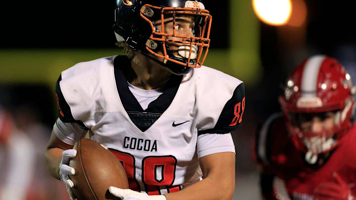 Cocoa's Jayvan Boggs (88) hauls in a reception for a touchdown