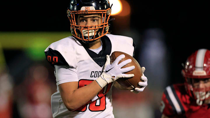 Cocoa's Jayvan Boggs (88) hauls in a reception for a touchdown score