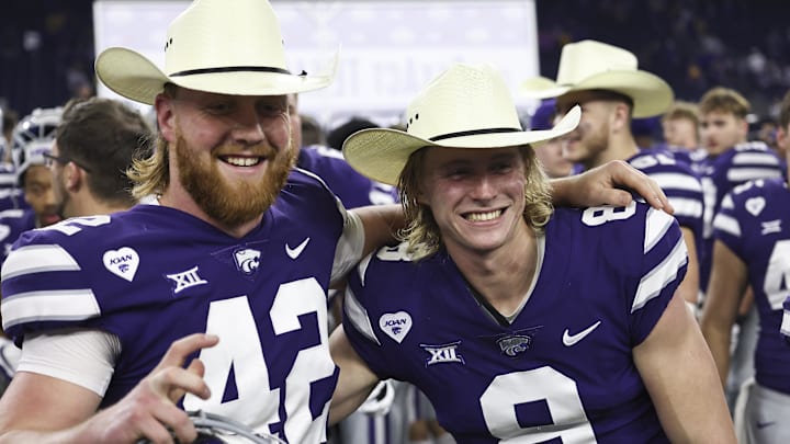 Jan 4, 2022; Houston, TX, USA; Kansas State Wildcats long snapper Randen Plattner (42) and Kansas State Wildcats punter Ty Zentner (8) celebrate winning the Texas Bowl after defeating the LSU Tigers in the 2022 Texas Bowl at NRG Stadium. Mandatory Credit: Thomas Shea-USA TODAY Sports