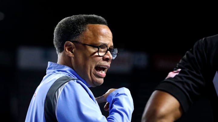 Liberty head men's basketball coach Ritchie McKay talks with the referee during a break in the Mens’ Basketball game against Middle Tennessee at MTSU, on Thursday, March 6, 2025.