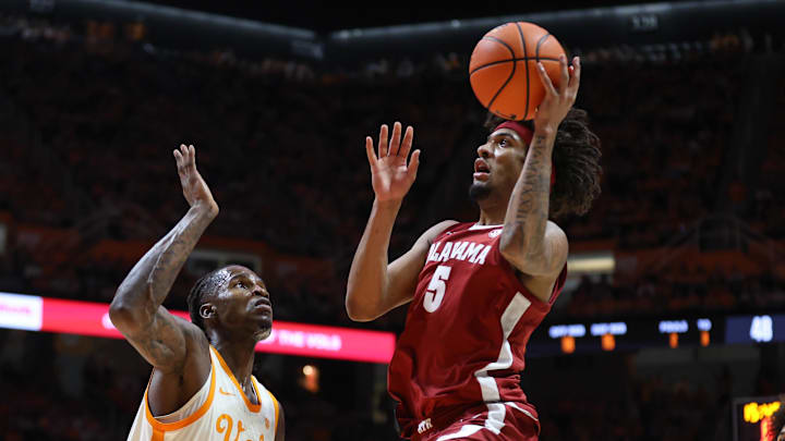Feb 28, 2026; Knoxville, Tennessee, USA;  Alabama Crimson Tide forward Amari Allen (5) goes to the basket against Tennessee Volunteers center Felix Okpara (34) during the second half at Thompson-Boling Arena at Food City Center. Mandatory Credit: Randy Sartin-Imagn Images